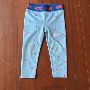 Nike Dri-Fit leggings. Blue with red swoosh. Size 2T.